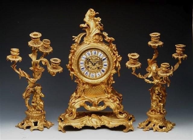 Appraisal: A FRENCH ROCOCO GARNITURE DE CHEMINEE the mantel clock with