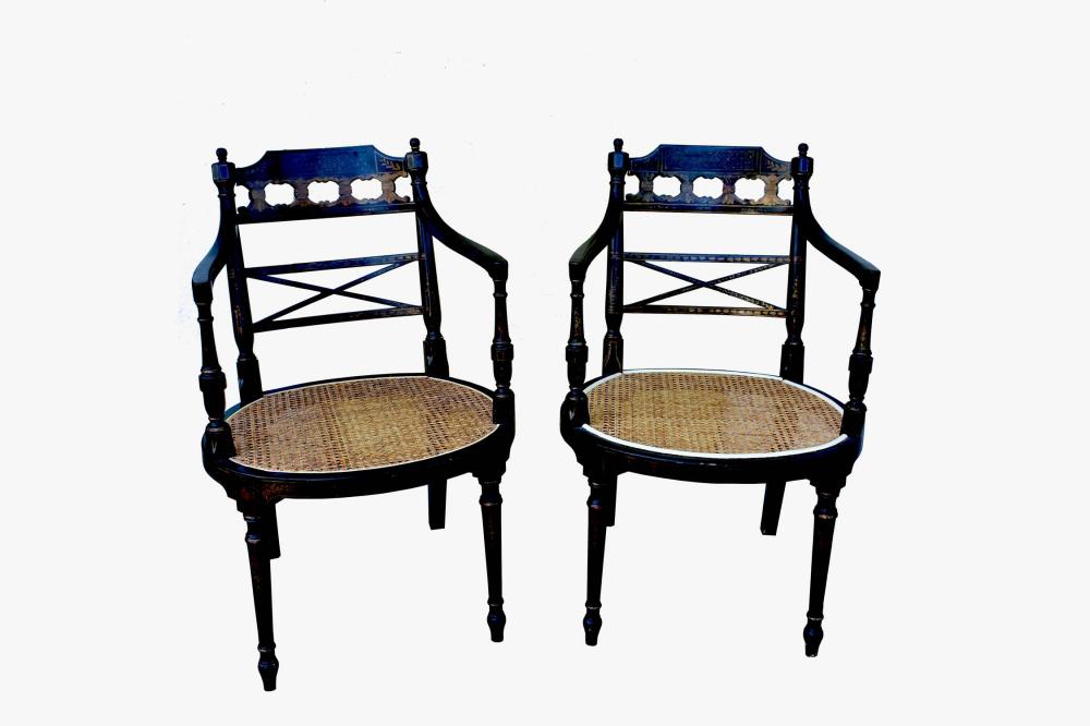 Appraisal: PAIR OF REGENCY STYLE EBONIZED CANED ARMCHAIRSEach curved open back