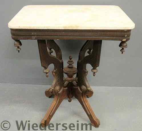 Appraisal: Victorian walnut occasional table with a marble top h x