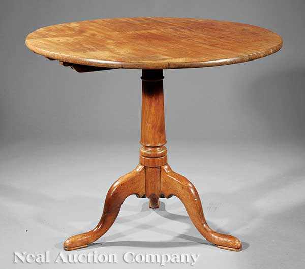 Appraisal: A Georgian Walnut Tilt-Top Tea Table th c turned tapered