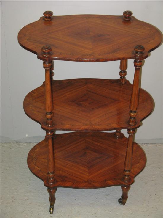 Appraisal: Rosewood quarter veneered and parquetry inlaid three tiered what not