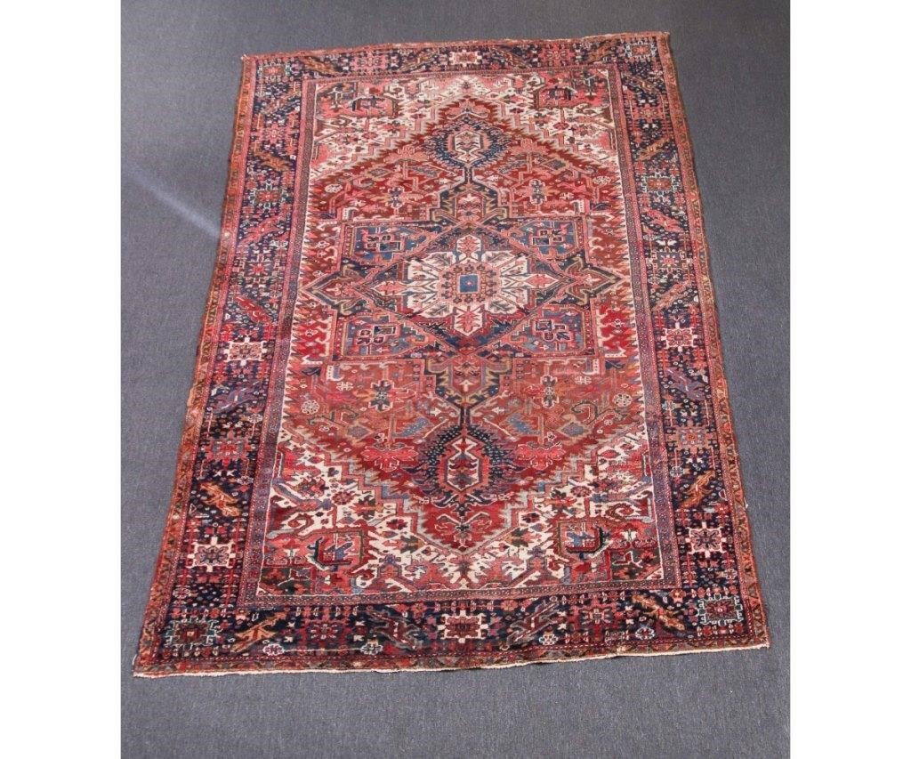 Appraisal: Room size Heriz carpet with center medallion geometric patterns on