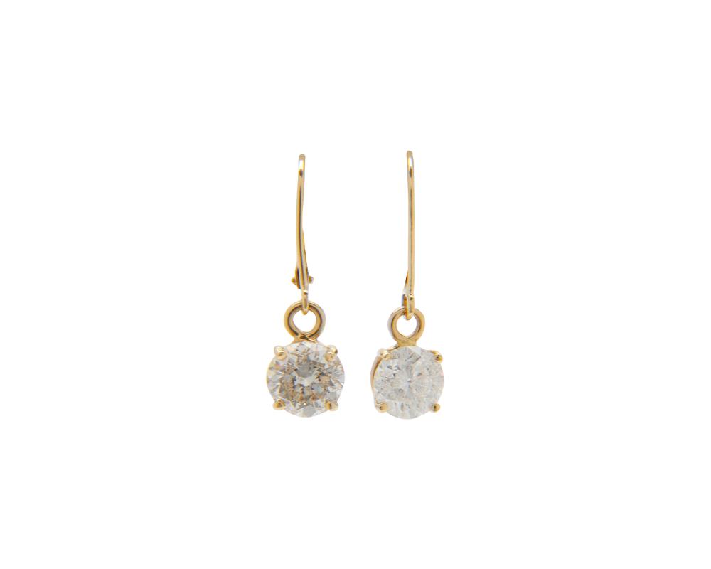 Appraisal: K Gold and Diamond Pendant Earrings each suspending a four-prong