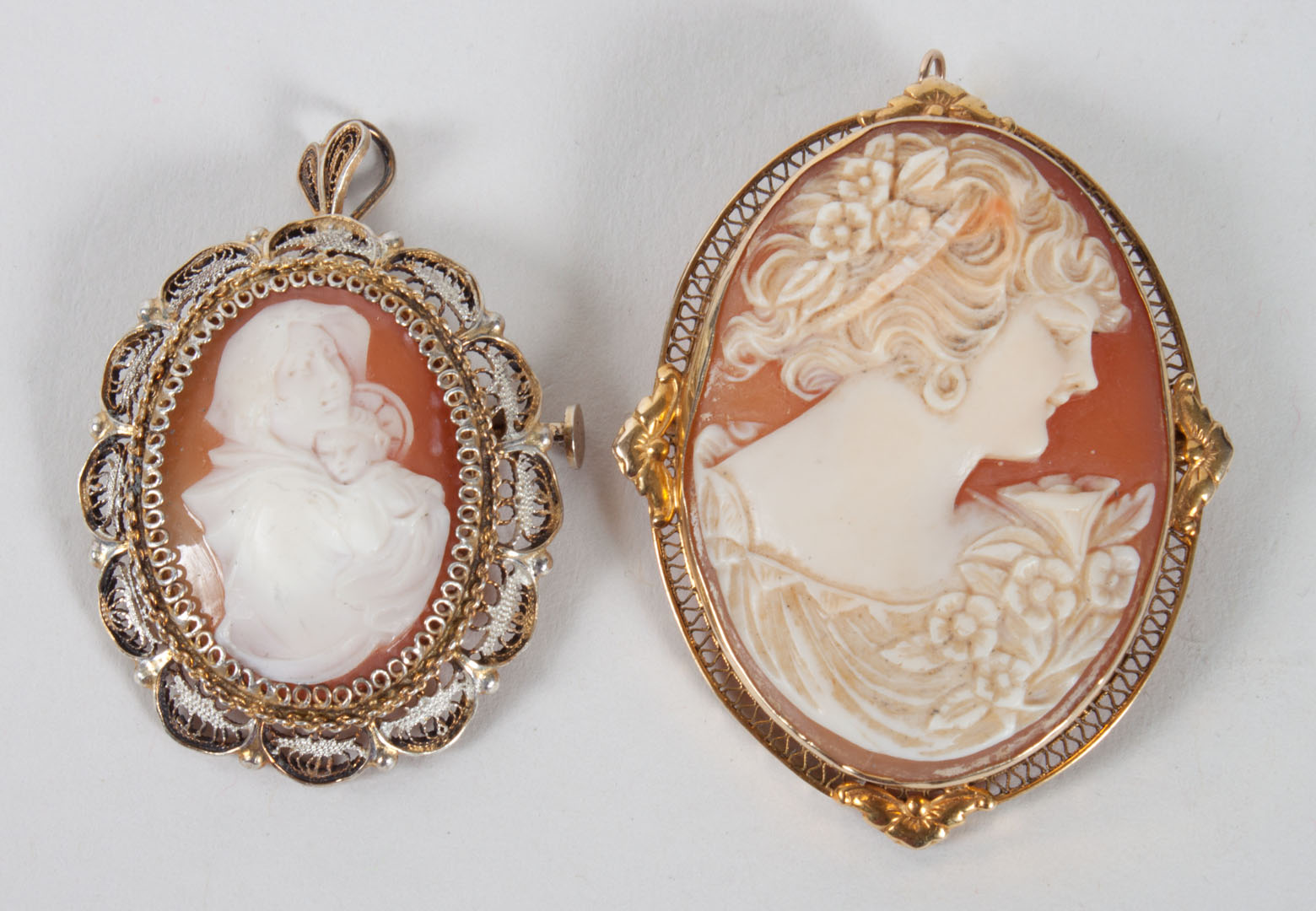 Appraisal: Two carved cameo brooches pendants carved cameo of a young