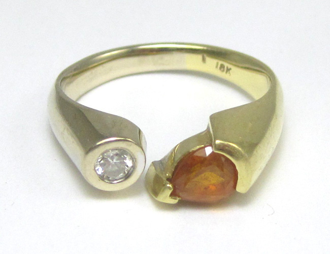 Appraisal: GOLDEN SAPPHIRE AND DIAMOND RING k yellow and white gold