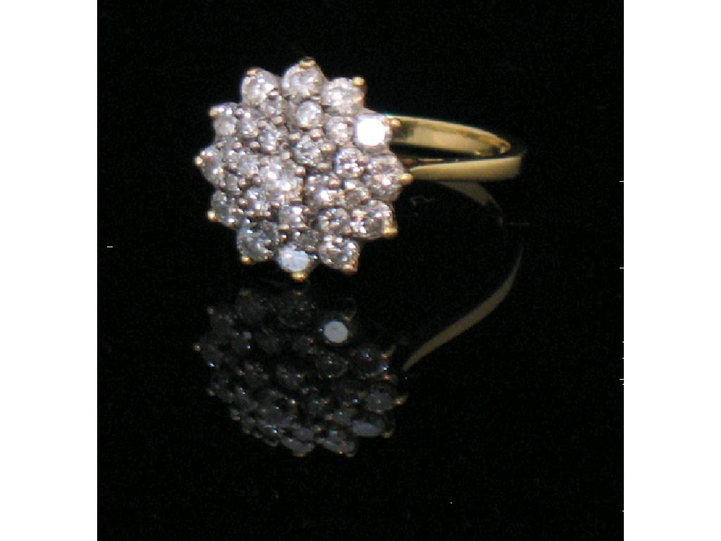 Appraisal: A DIAMOND CLUSTER DRESS RING set with three graduated clusters