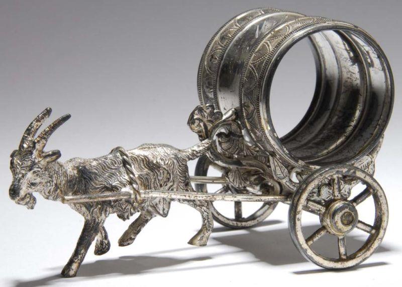 Appraisal: Goat Pulling Figural Napkin Ring on Wheels Description No manufacturer's