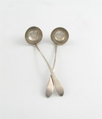 Appraisal: A pair of George III Scottish provincial silver toddy ladles