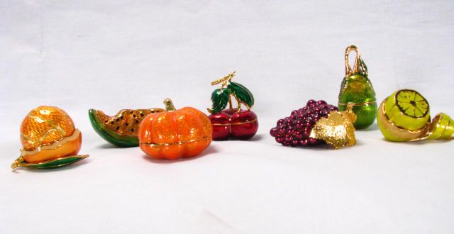 Appraisal: Seven Edgar Berebi enameled fruit ornaments including pumpkin grape lemon