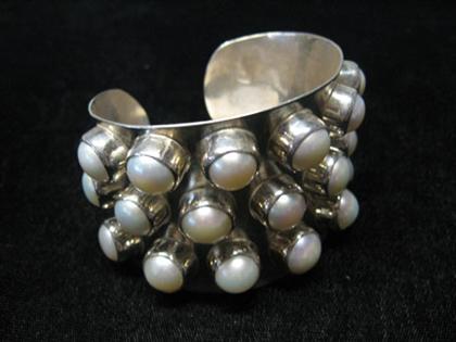 Appraisal: Sterling cuff with baroque pearls Wide sterling cuff bracelet featuring