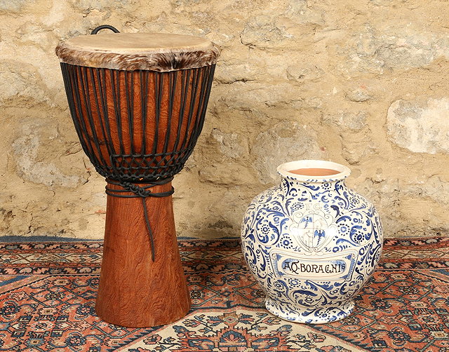 Appraisal: A TRIBAL WOODEN DRUM cm high and a blue and