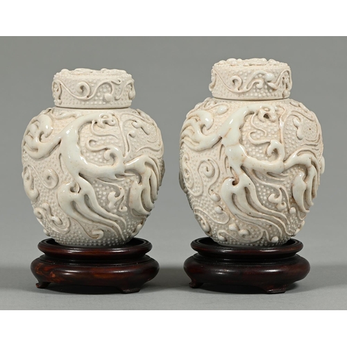 Appraisal: A pair of Chinese white glazed porcelain tea caddies and