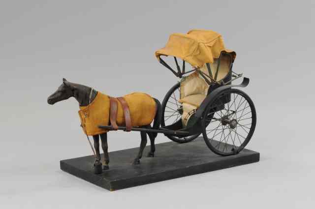 Appraisal: HORSE DRAWN RICKSHAW Tin plate upholstered interior spoke wheels folding