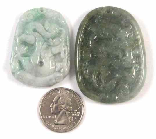 Appraisal: TWO CARVED GREEN JADE PENDANTS both carved on one side