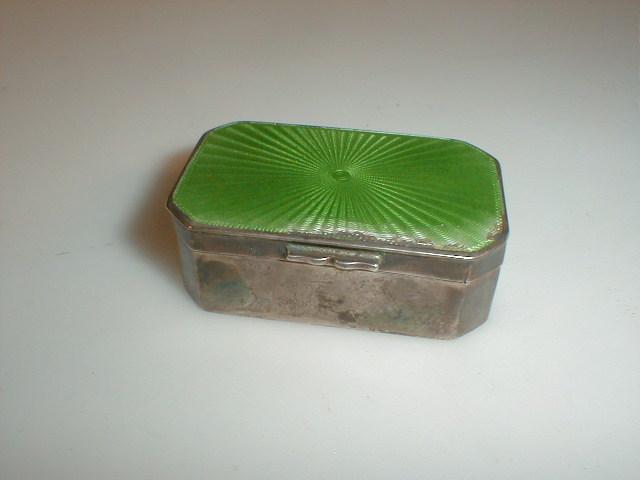 Appraisal: A George V silver snuff box with green enamelled hinged