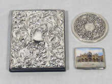 Appraisal: A silver book match holder with enamelled picture of St