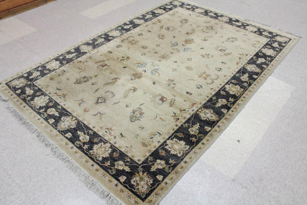 Appraisal: HAND KNOTTED ORIENTAL CARPET Indo-Persian overall floral design on khaki