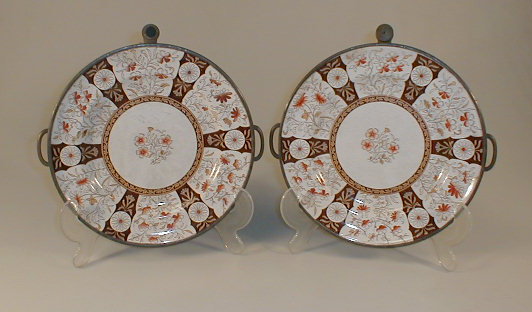 Appraisal: A pair of Victorian warming plates with orange floral decoration