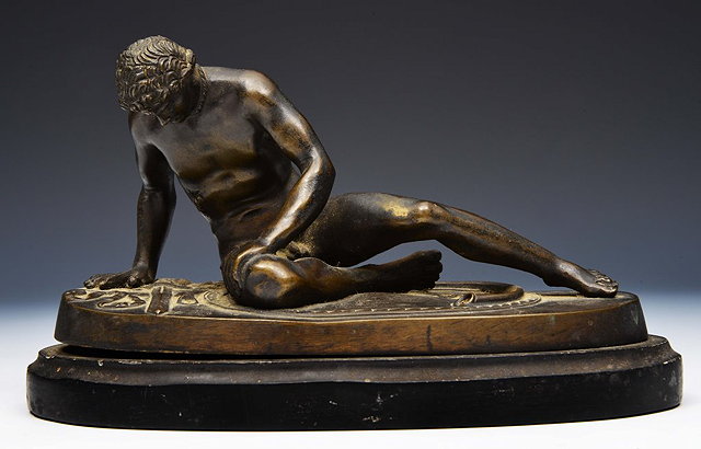 Appraisal: A CLASSICAL GRAND TOUR STYLE BRONZE RECUMBENT FIGURE on an