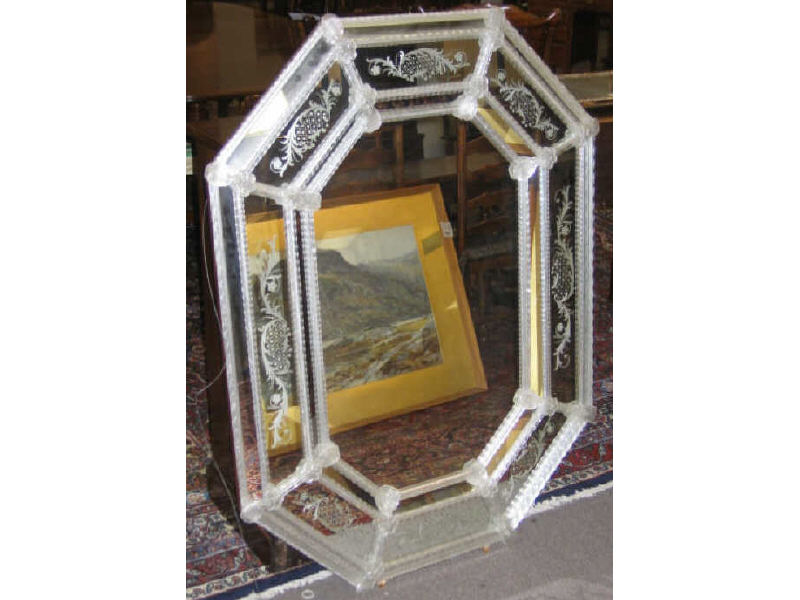 Appraisal: VENETIAN WALL MIRROR Applied glass ornamentation surrounds the octagonal panel