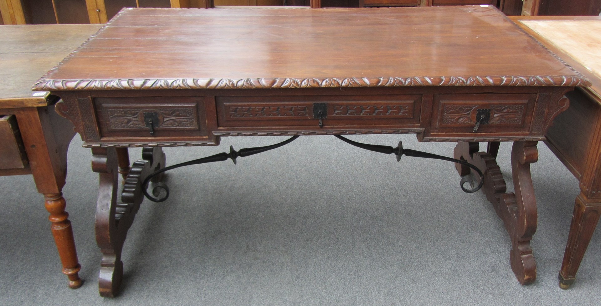 Appraisal: A th century Spanish carved walnut rectangular dining table with