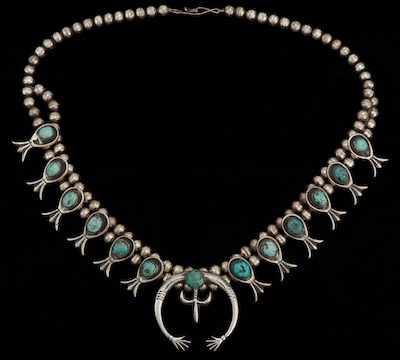 Appraisal: A Silver and Turquoise Squash Blossom Necklace Traditionally styled squash