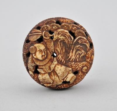 Appraisal: A Manju Netsuke Carved bone of boy and fan rubbed