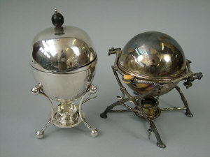 Appraisal: An Edwardian silver egg coddler Sheffield of typical form with