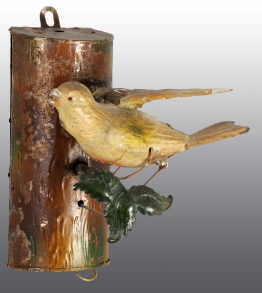 Appraisal: Tin Hand-Painted Bird on Log Wind-Up Toy Description German Toy