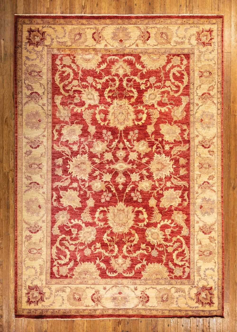 Appraisal: Oushak Carpet light red and cream ground overall floral design