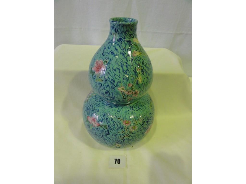 Appraisal: A th century oriental turquoise ground vase of double gourd