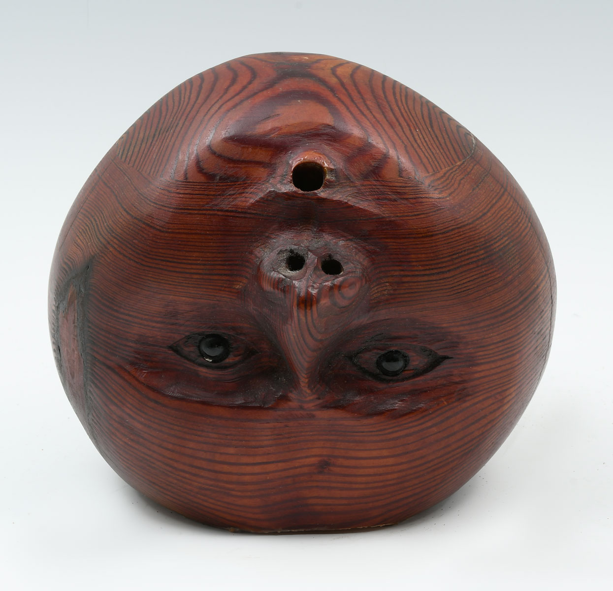 Appraisal: UNUSUAL UNSIGNED MID-CENTURY CARVED UPSIDE-DOWN WOOD HEAD Glass eyes ''