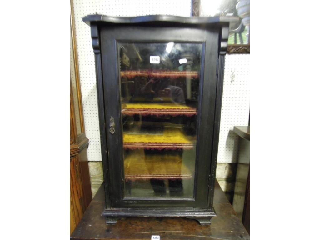 Appraisal: An Edwardian music cabinet with ebonised frame and raised three