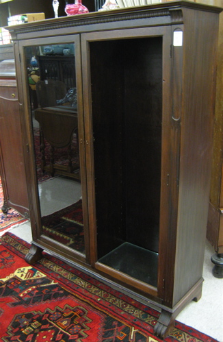 Appraisal: DARK MAHOGANY AND WALNUT CABINET BOOKCASE American c 's The