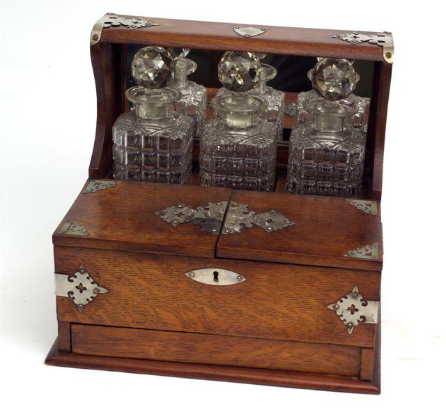 Appraisal: OAK SILVER-PLATE MOUNTED TANTALUS c inset with three square glass