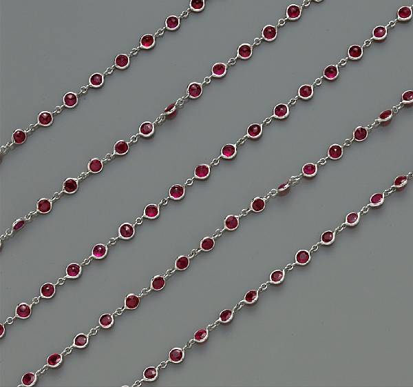 Appraisal: A ruby long chain necklace mounted in fourteen karat white