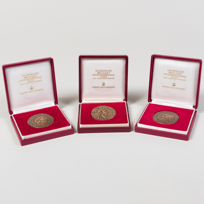 Appraisal: Giacomo Manzu Mozart Three Medallions Bronze in fitted cases The