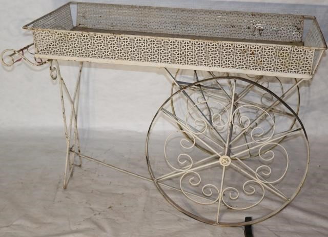 Appraisal: WHITE PAINTED WROUGHT IRON AND MASONITE FLOWERCART ORNATE DETAILS IN