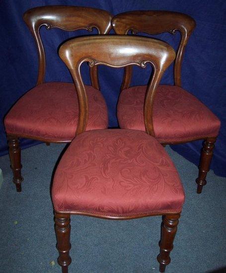 Appraisal: A set of three Victorian mahogany dining chairs with overstuffed