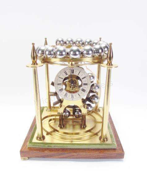 Appraisal: English Brass Spherical Weight Clock a mahogany and brass spherical