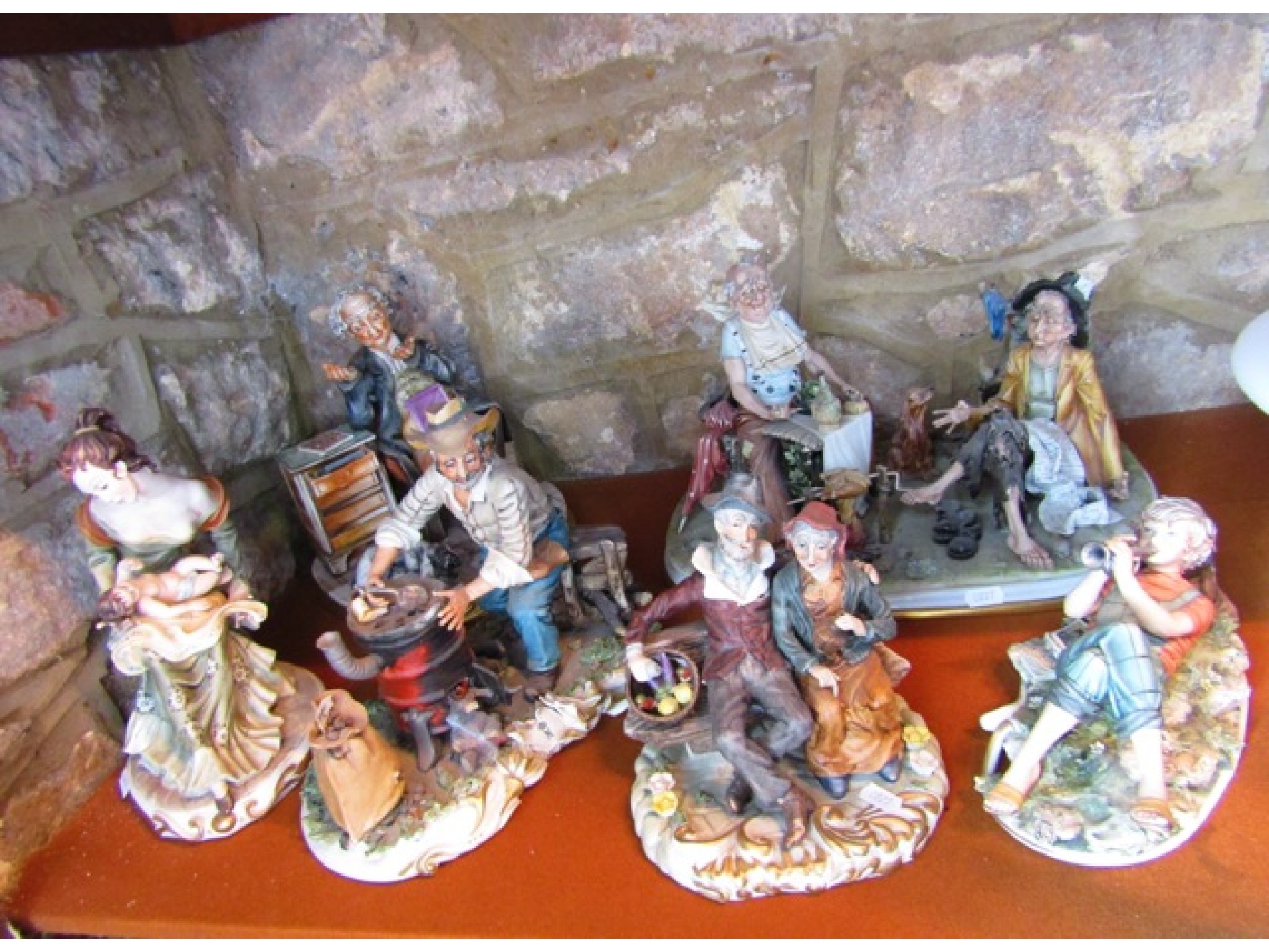 Appraisal: A collection of Capodimonte and Capodimonte style figure groups including