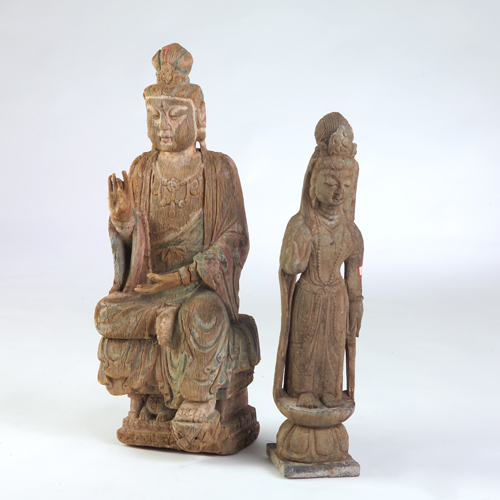 Appraisal: Two Buddhas one of carved wood with remains of paint