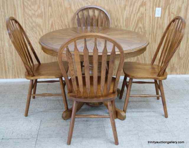 Appraisal: Oak Pedestal '' Round Dining Table ChairsThis is for a