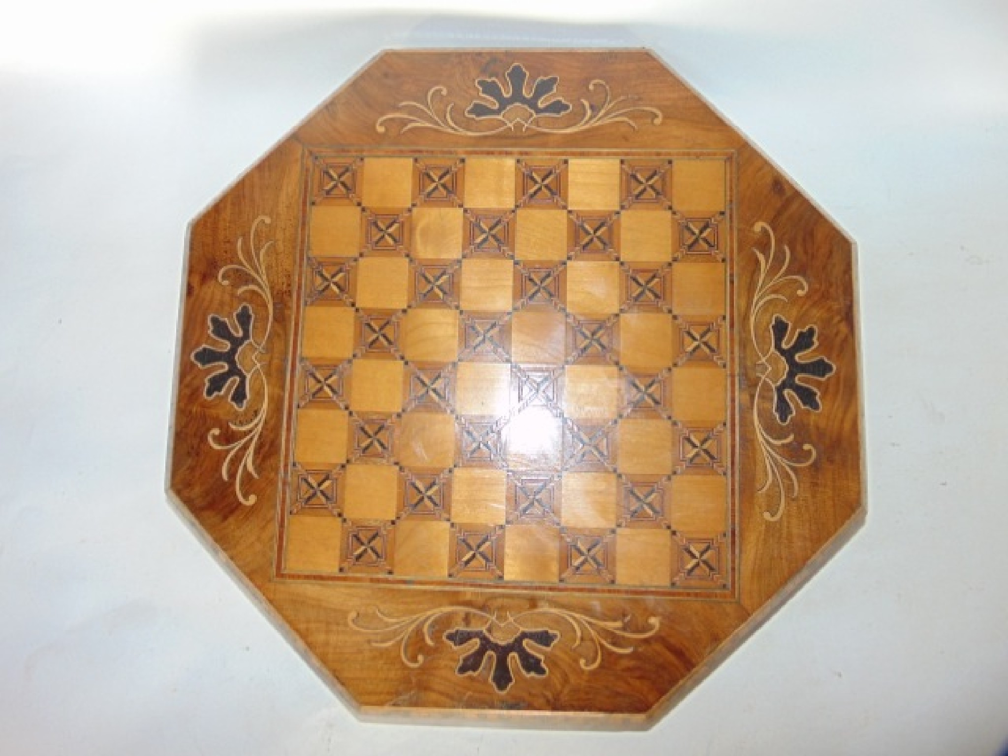 Appraisal: An antique veneered games box of octagonal form principally in