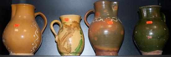 Appraisal: Four glazed earthenware pitchers Estimate - No condition report supplied