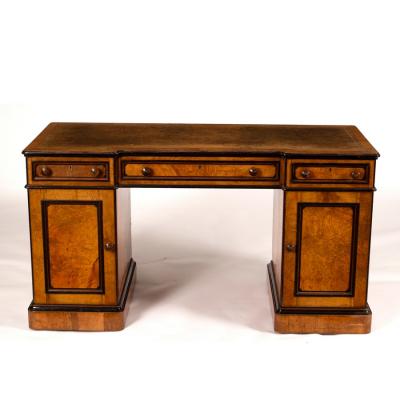 Appraisal: A breakfront kneehole desk by Lamb of Manchester in burr