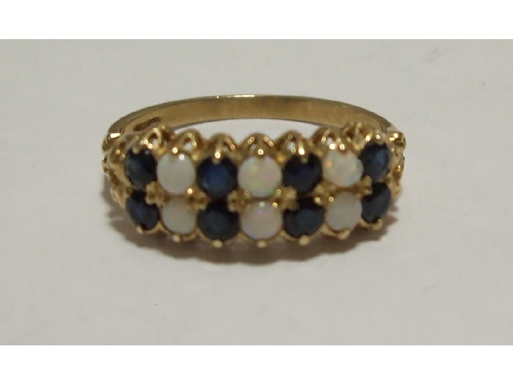 Appraisal: Nine carat gold opal and sapphire double row fourteen stone