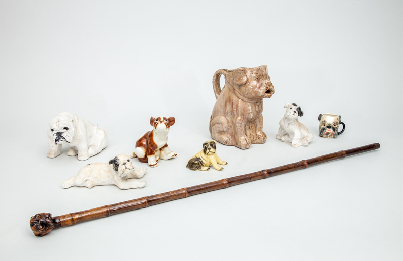 Appraisal: GROUP OF SEVEN DOG FIGURAL ARTICLES Comprising a drip-glazed pottery