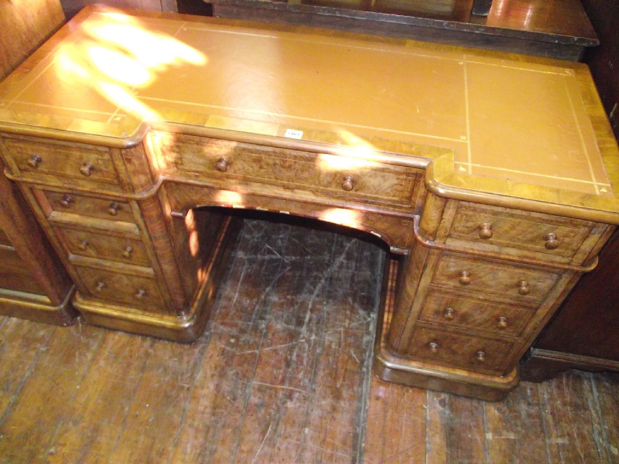 Appraisal: A Victorian figured walnut inverted breakfront writing desk of pedestal