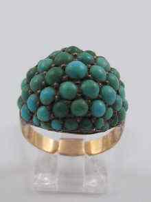 Appraisal: A yellow metal tests ct gold turquoise bombe ring